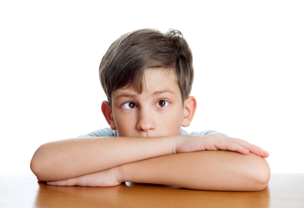 A young boy with strabismus or crossed eyes